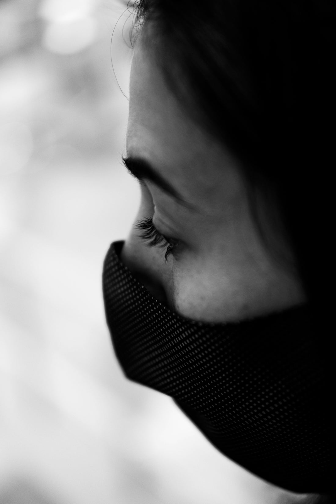 grayscale photo of womans face