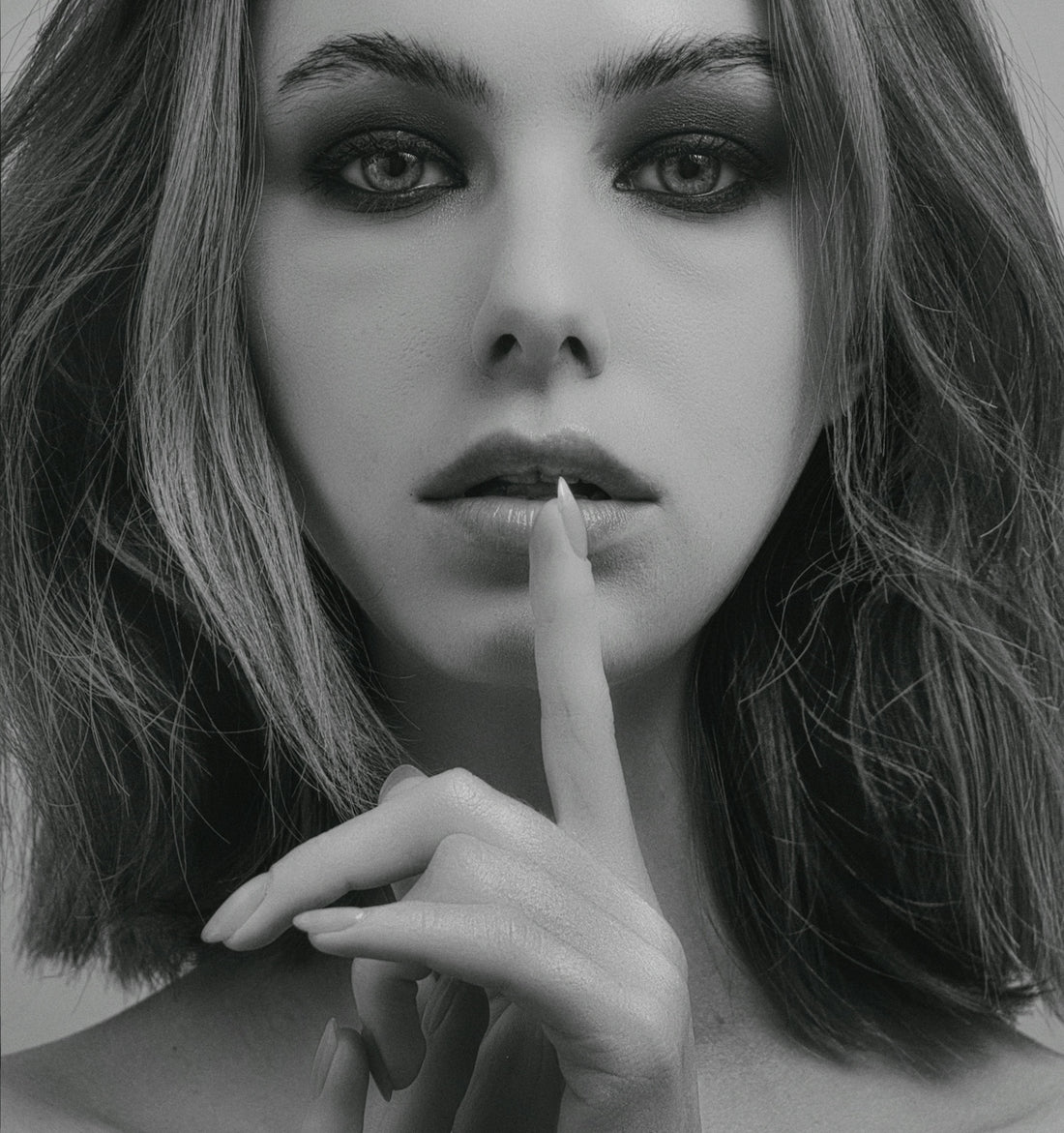 a woman with a cigarette in her mouth