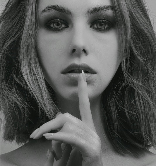 a woman with a cigarette in her mouth