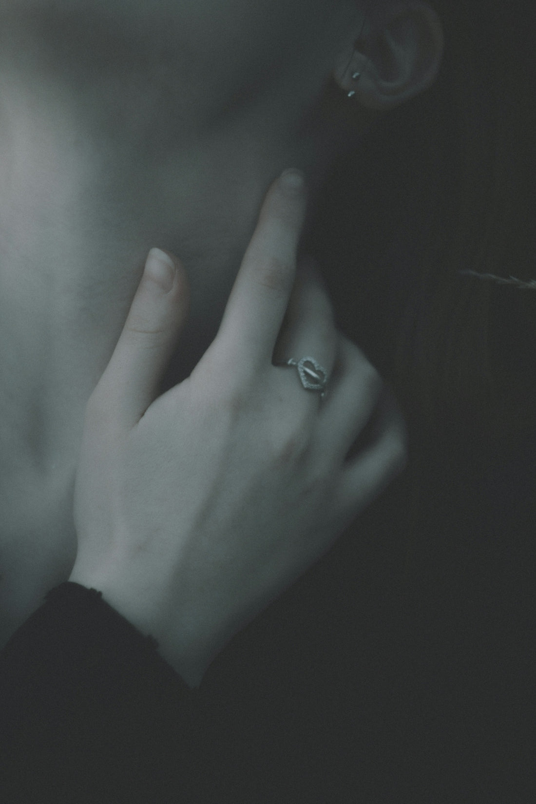 a close up of a person wearing a ring