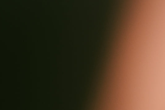 Dark green fading to light orange gradient