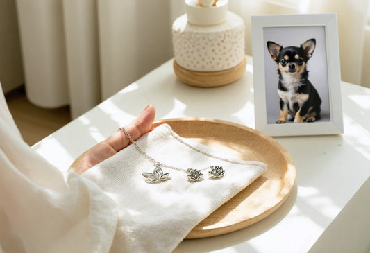 Chihuahua jewelry gifts featuring lotus charms beside a framed chihuahua photo, perfect for meaningful connections